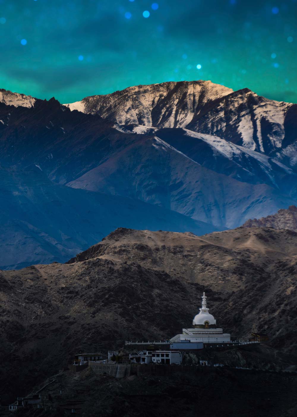 Night sky, mountains and building